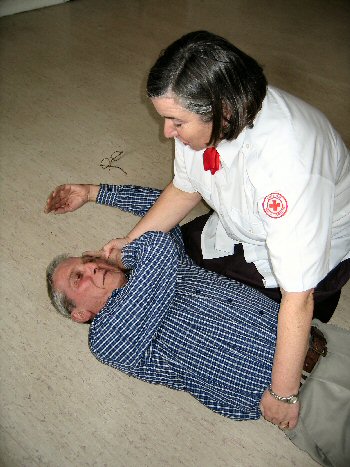 Doreen demonstrates moving the patient to the recovery position